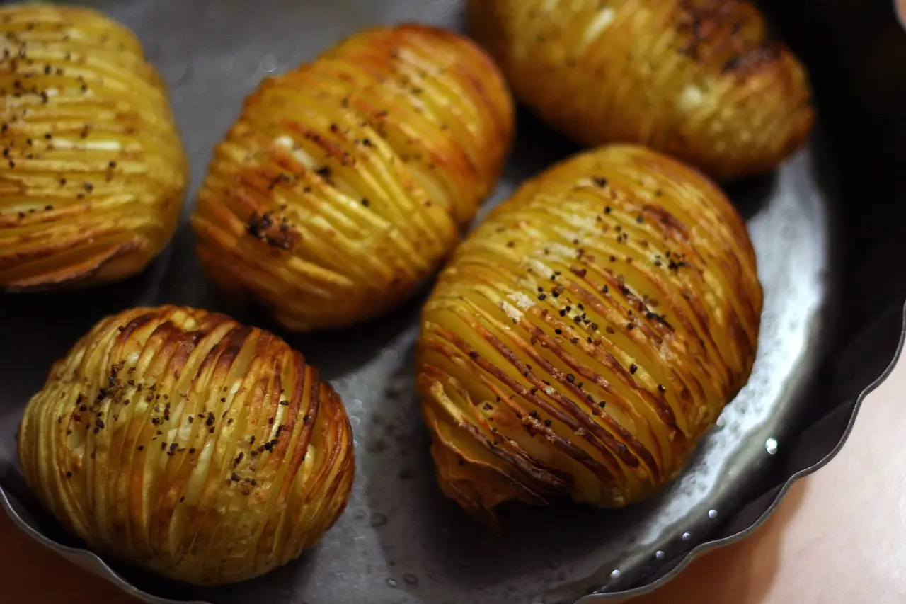 hasselback potatoes on a dish