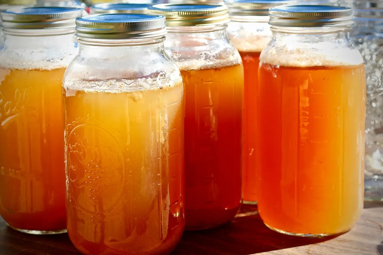 glass mason jars filled with amber fire cider