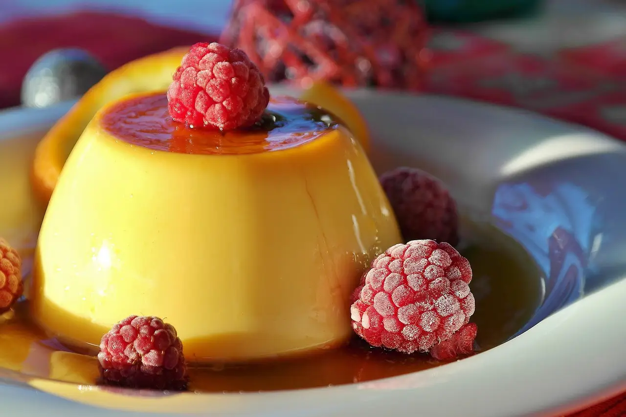 golden flan with red berries