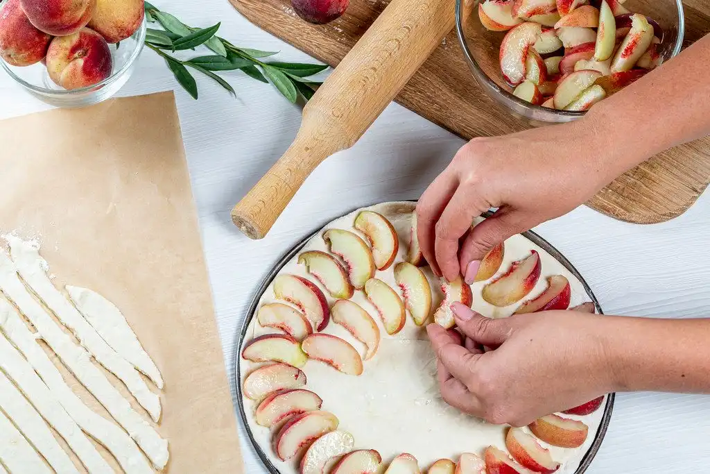 hands cooking with apples